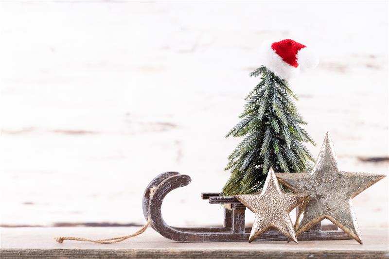 Christmas tree composition on wooden background.